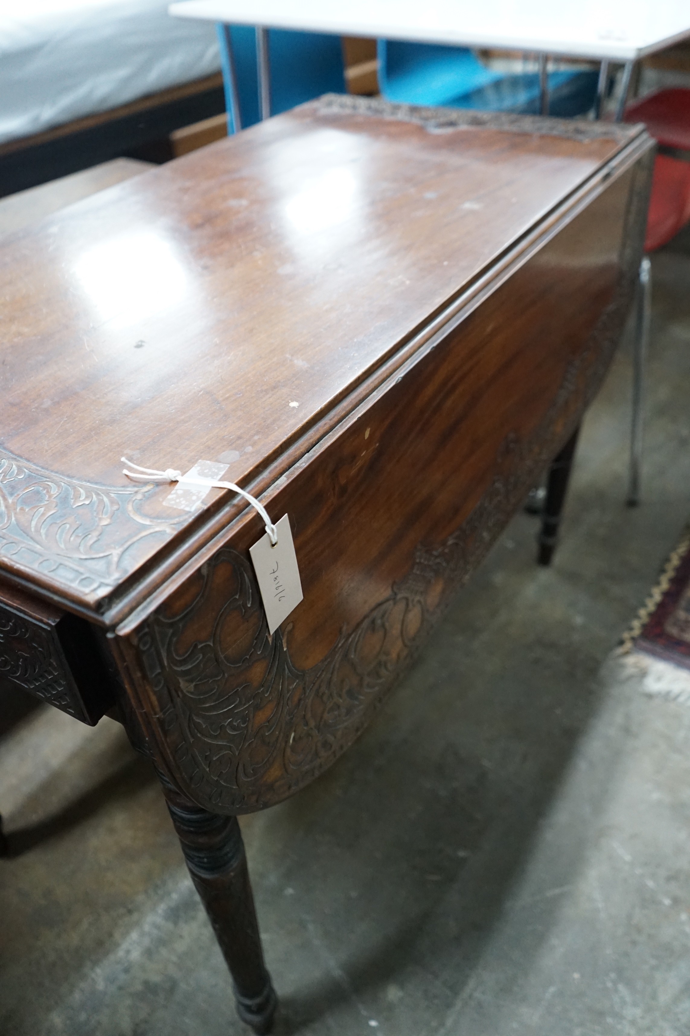 A Regency mahogany Pembroke table, later carved, width 89cms, depth 47cms, height 66cms.